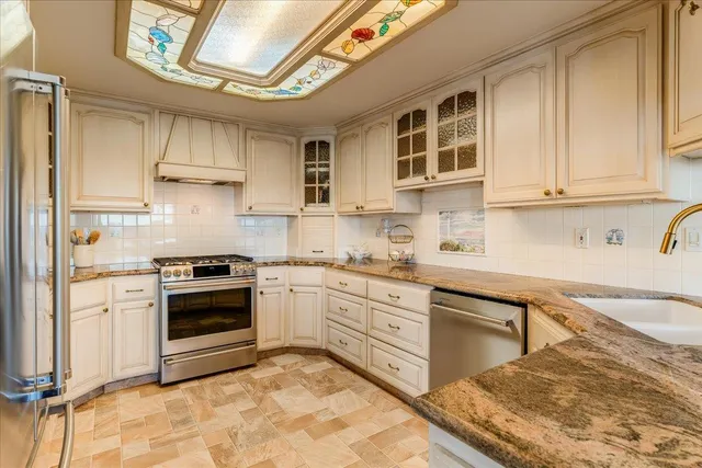 a bedroom with a bed and a television