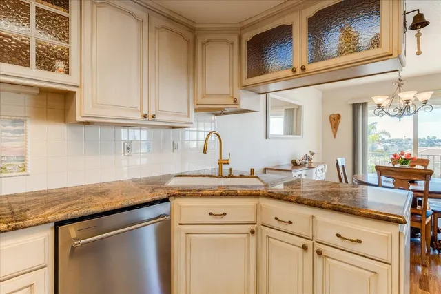 a bathroom with a sink vanity granite and a mirror