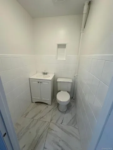 a spacious bathroom with a bathtub and a shower