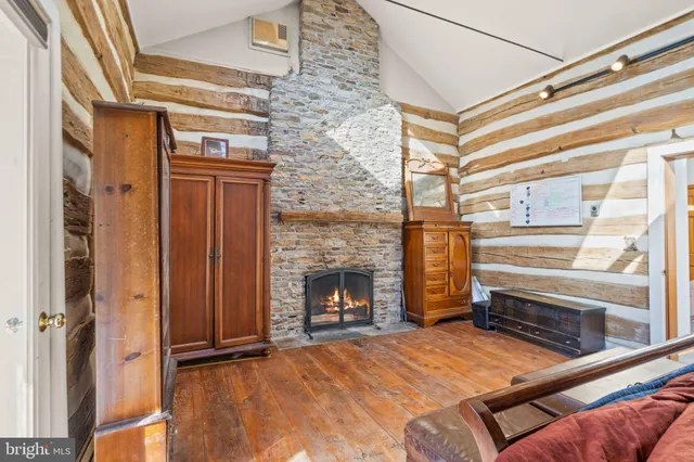 a bathroom with a granite countertop sink toilet a mirror a vanity and shower
