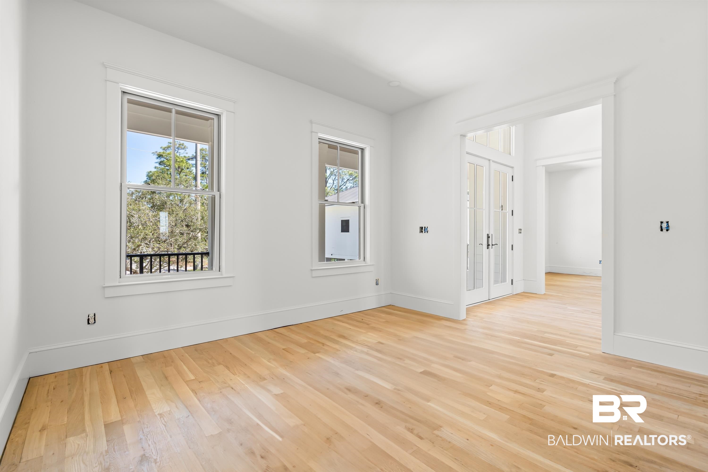 14686 State Highway Gulf Shores, AL 36542 - Photo 9 of 44 Spare room with baseboards and light wood-style flooring