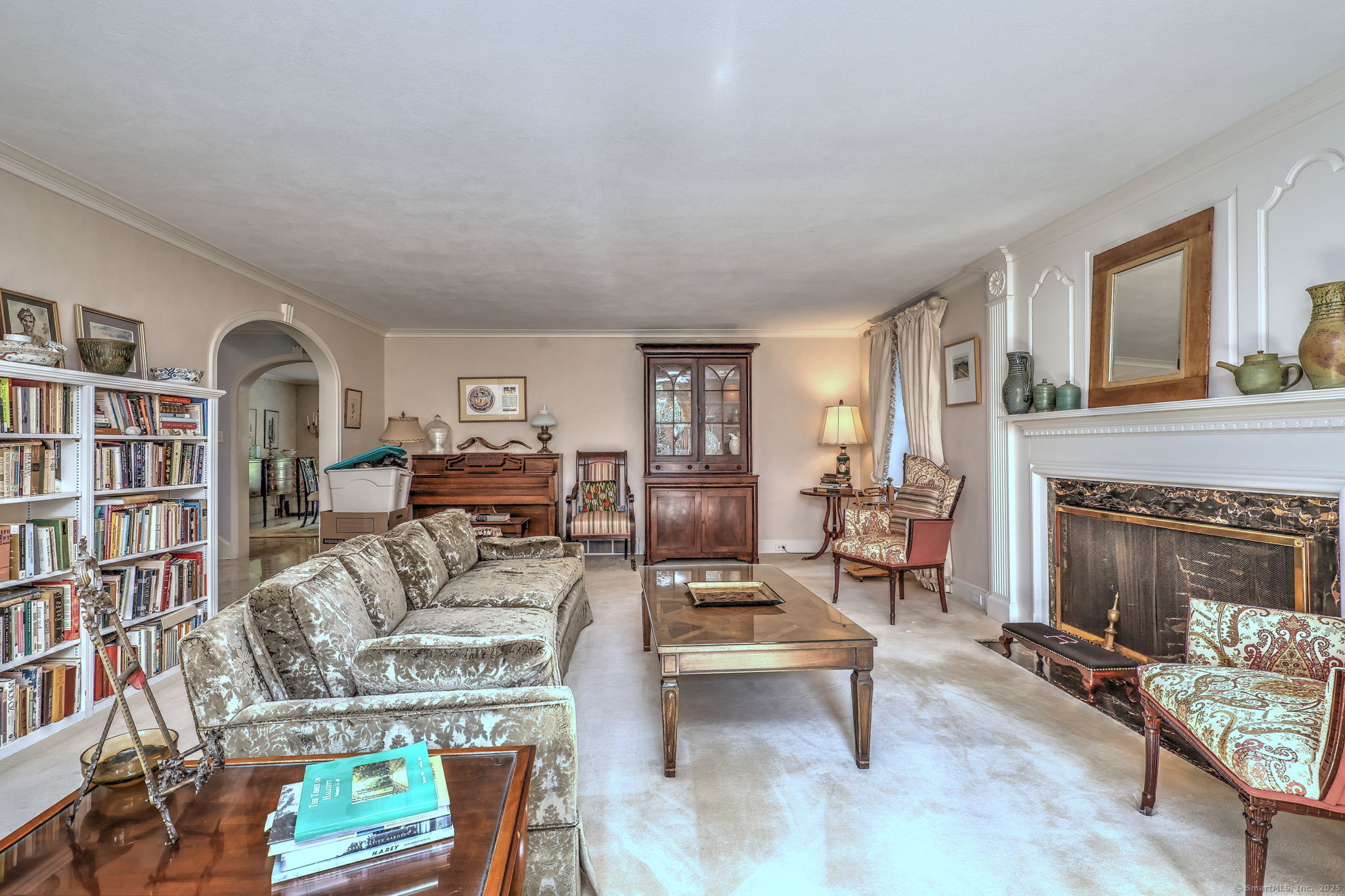 4 Brook Road Woodbridge, CT 06525 - Photo 12 of 40 a living room with furniture and a fireplace