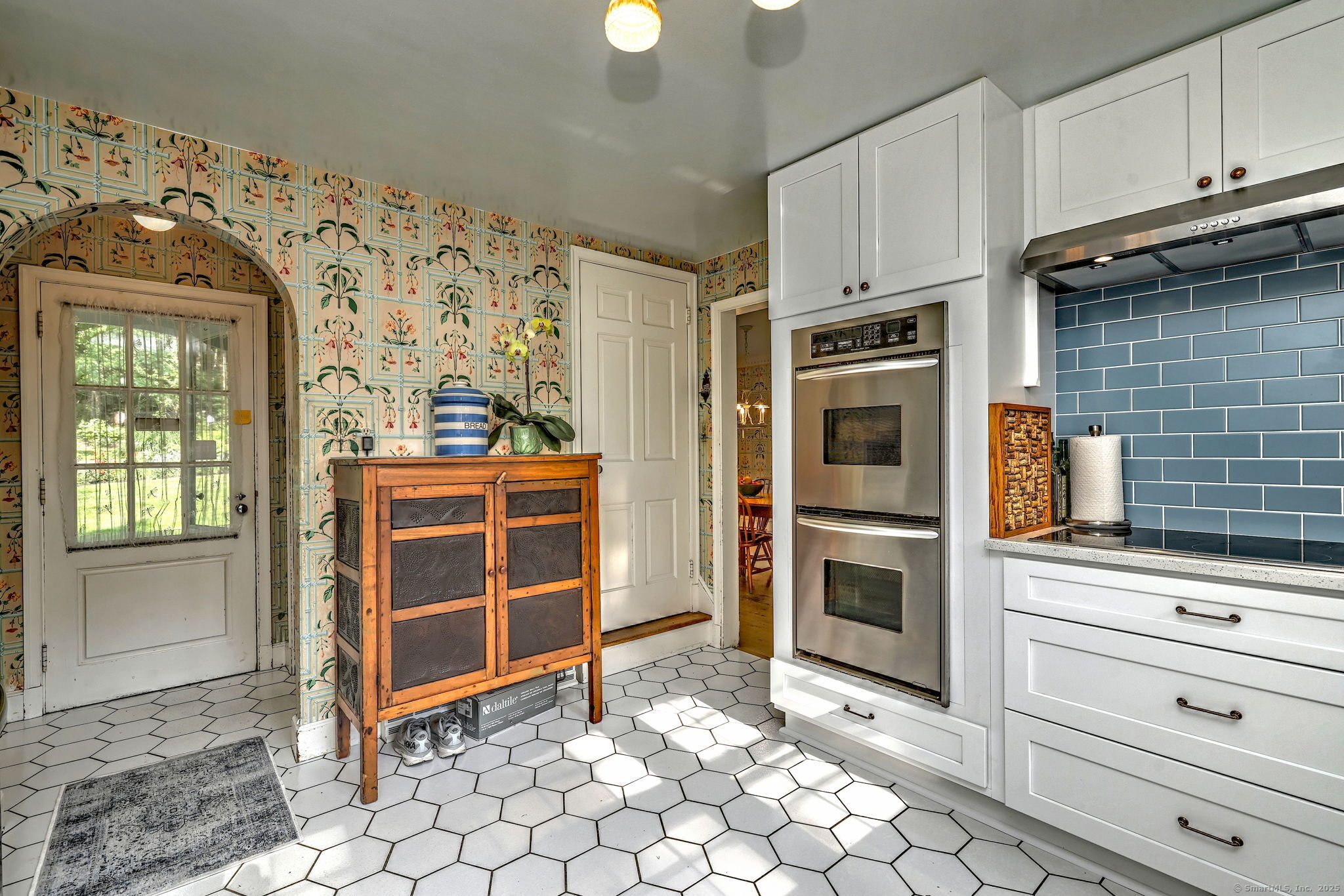 4 Brook Road Woodbridge, CT 06525 - Photo 14 of 40 a kitchen with stainless steel appliances a stove and a refrigerator
