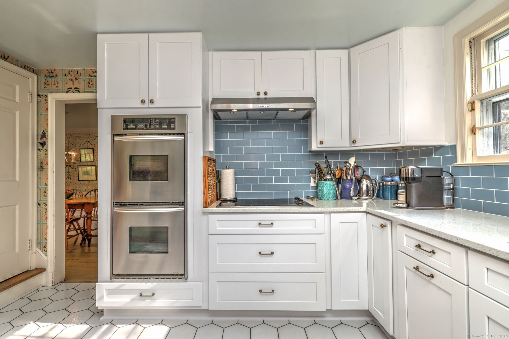 4 Brook Road Woodbridge, CT 06525 - Photo 15 of 40 a kitchen with white cabinets and appliances