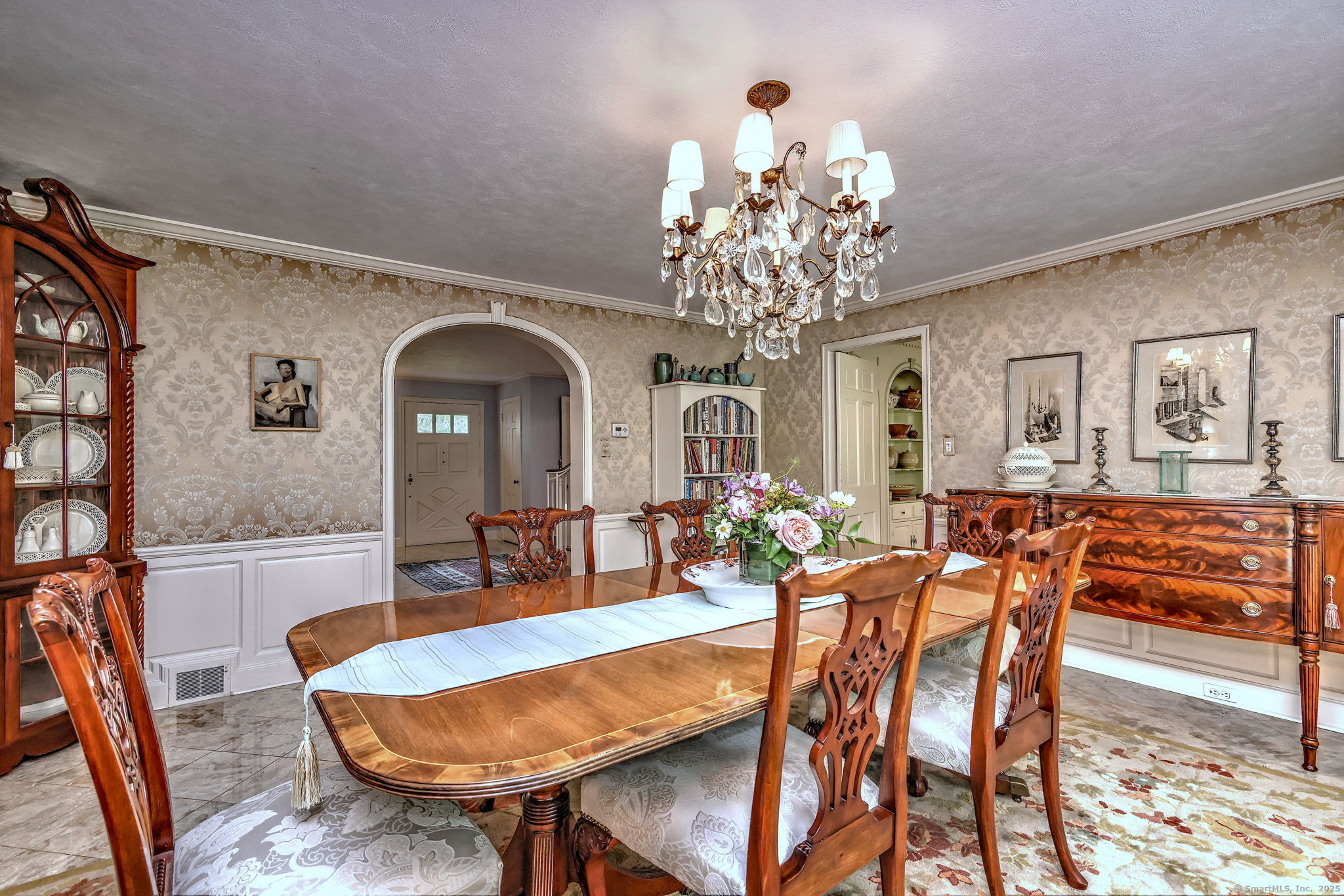 4 Brook Road Woodbridge, CT 06525 - Photo 16 of 40 a view of a dining room with furniture wooden floor and chandelier