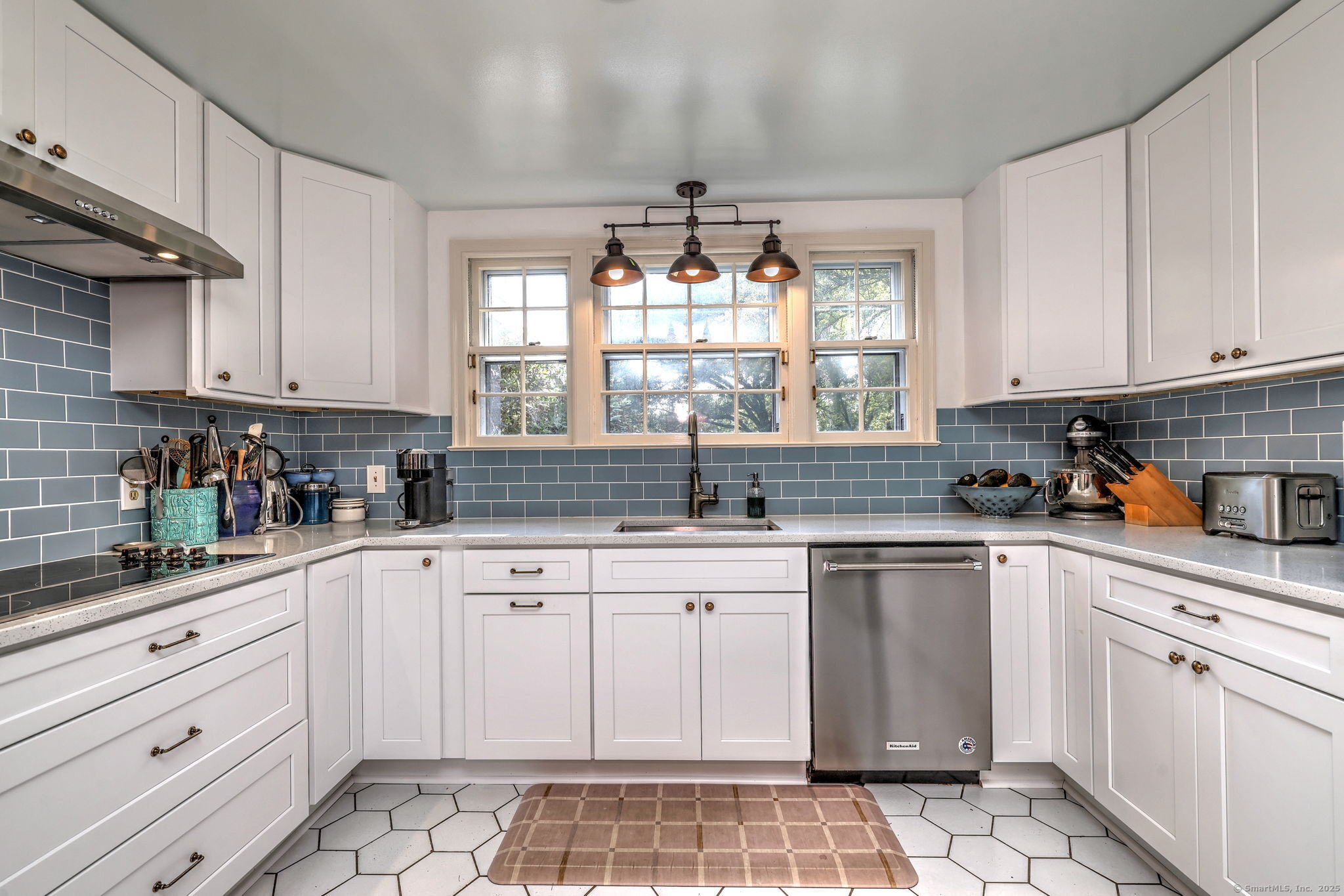 4 Brook Road Woodbridge, CT 06525 - Photo 16 of 40 a kitchen with white cabinets appliances and a sink