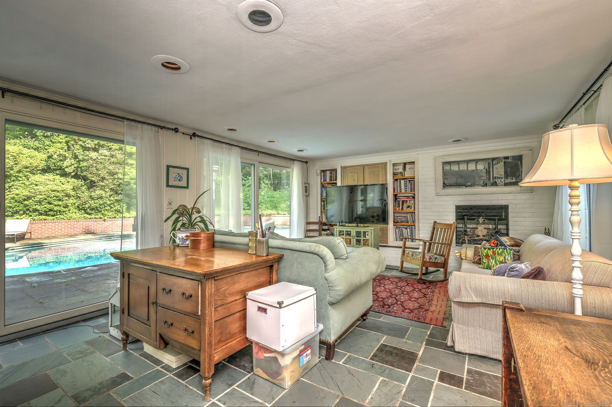 4 Brook Road Woodbridge, CT 06525 - Photo 21 of 40 a living room with furniture and a large window