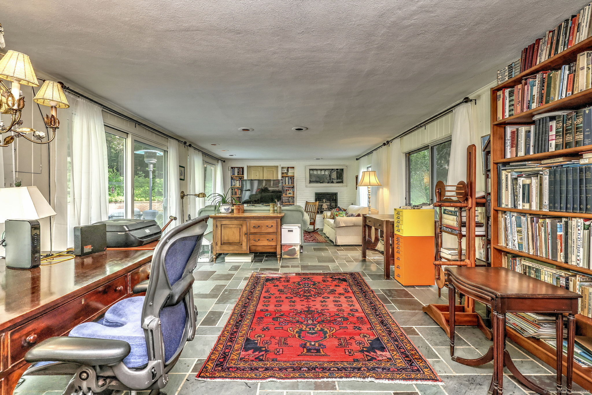 4 Brook Road Woodbridge, CT 06525 - Photo 23 of 40 a very nice looking living room with a large window and a table