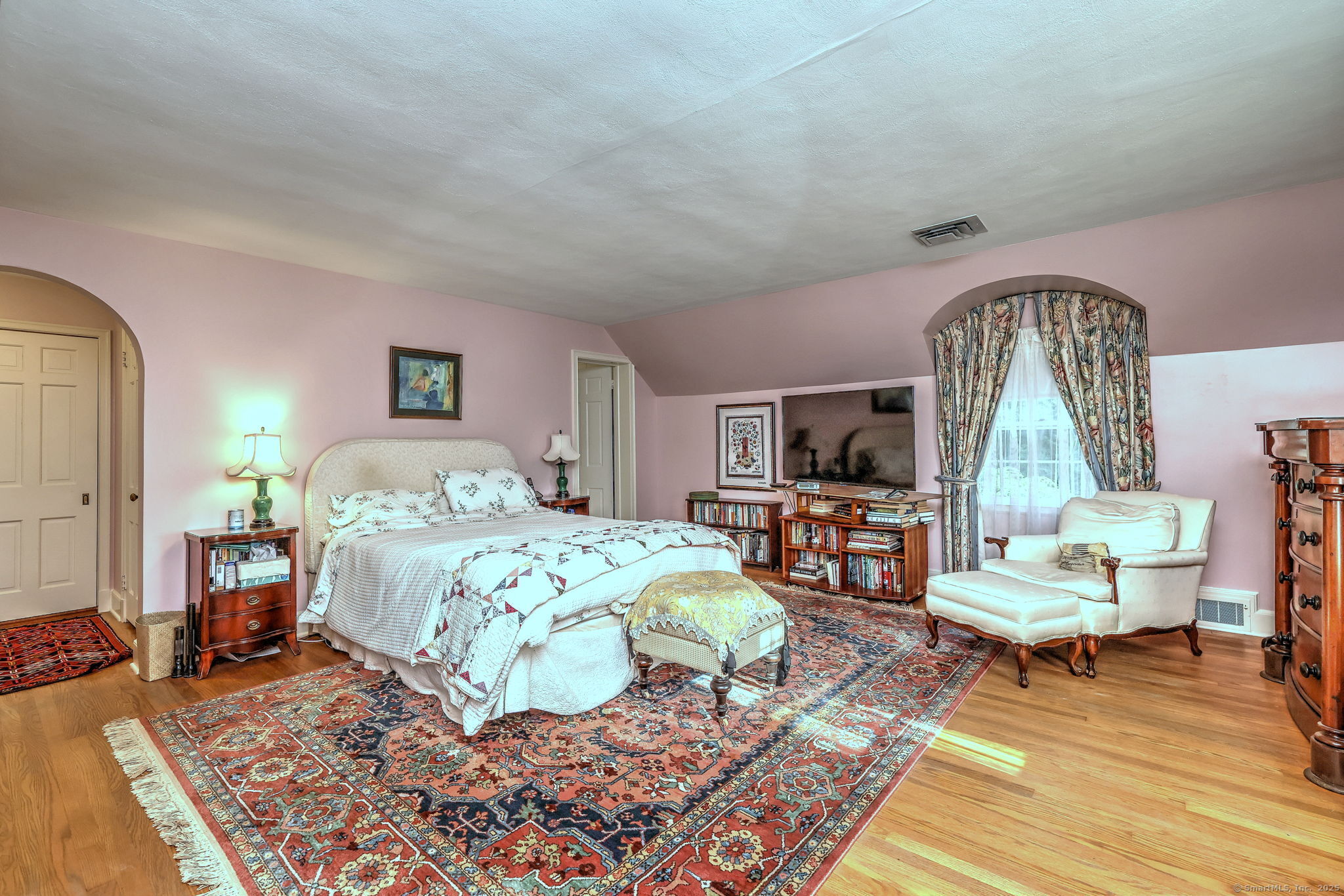 4 Brook Road Woodbridge, CT 06525 - Photo 27 of 40 a bedroom with a bed and wooden floor