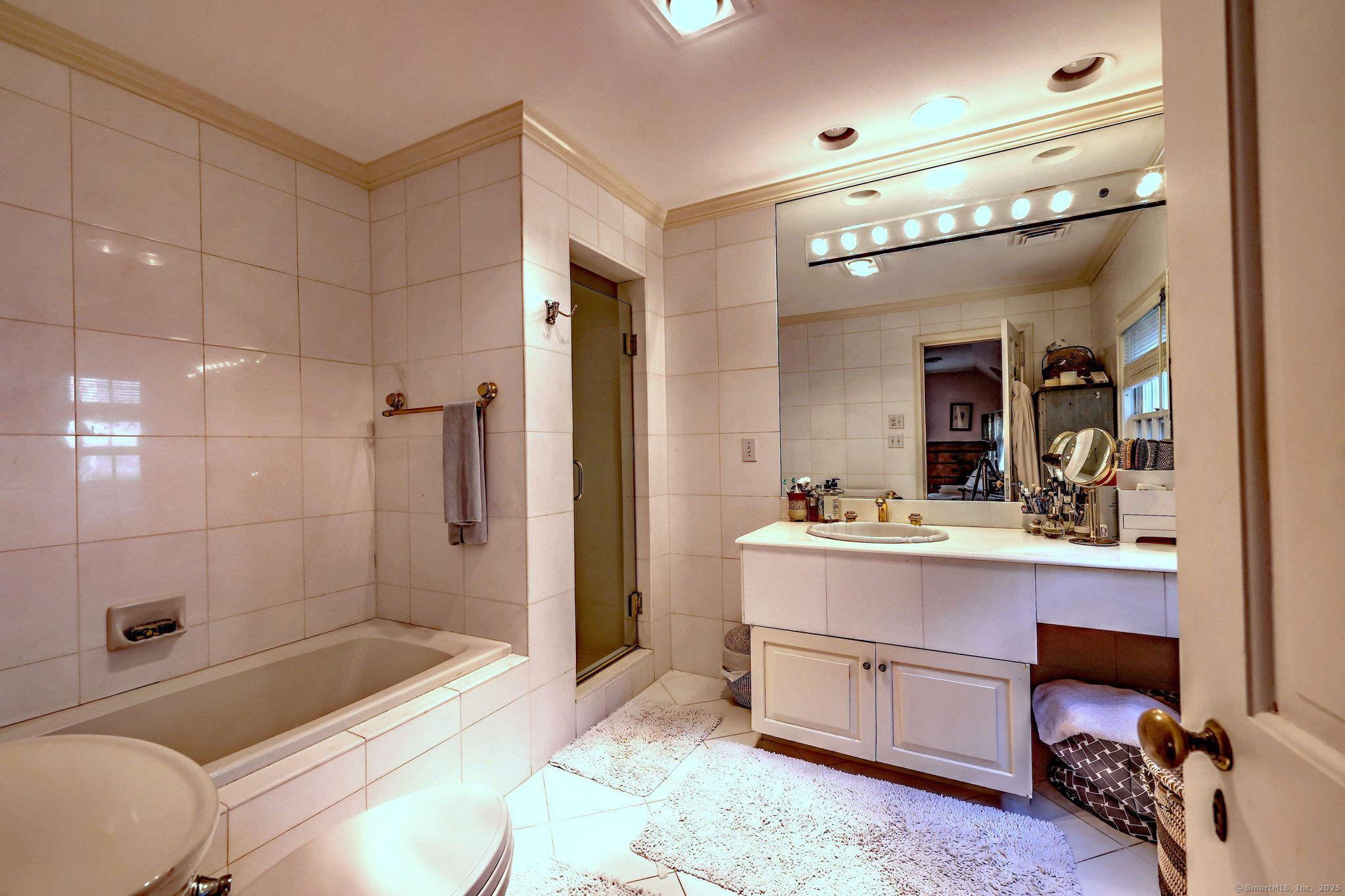 4 Brook Road Woodbridge, CT 06525 - Photo 28 of 40 a bathroom with a sink a toilet and shower