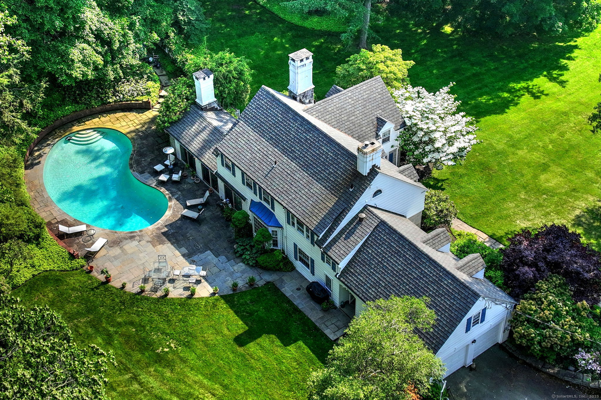 4 Brook Road Woodbridge, CT 06525 - Photo 3 of 40 an aerial view of a house with a garden