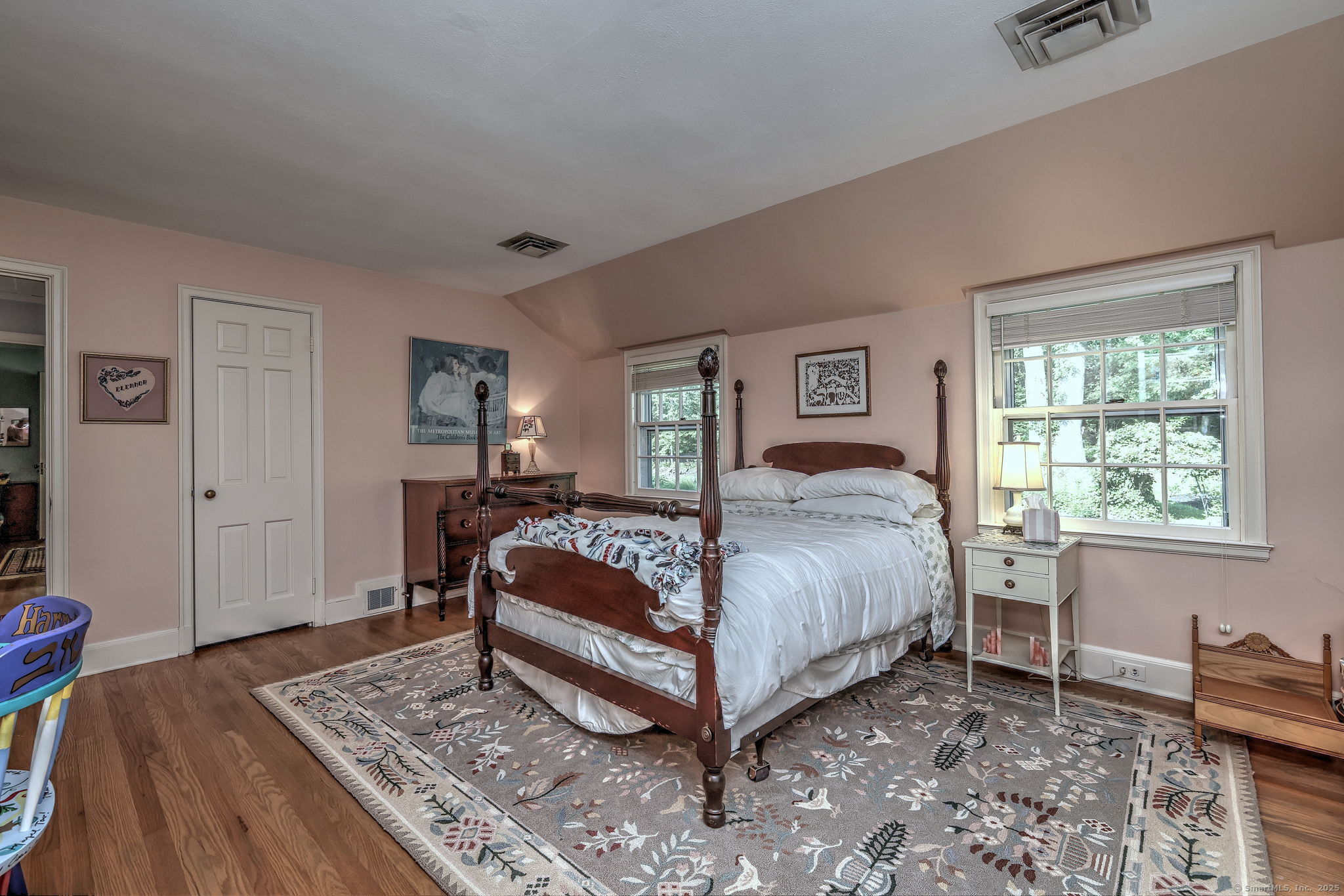 4 Brook Road Woodbridge, CT 06525 - Photo 32 of 40 a bedroom with a bed and wooden floor