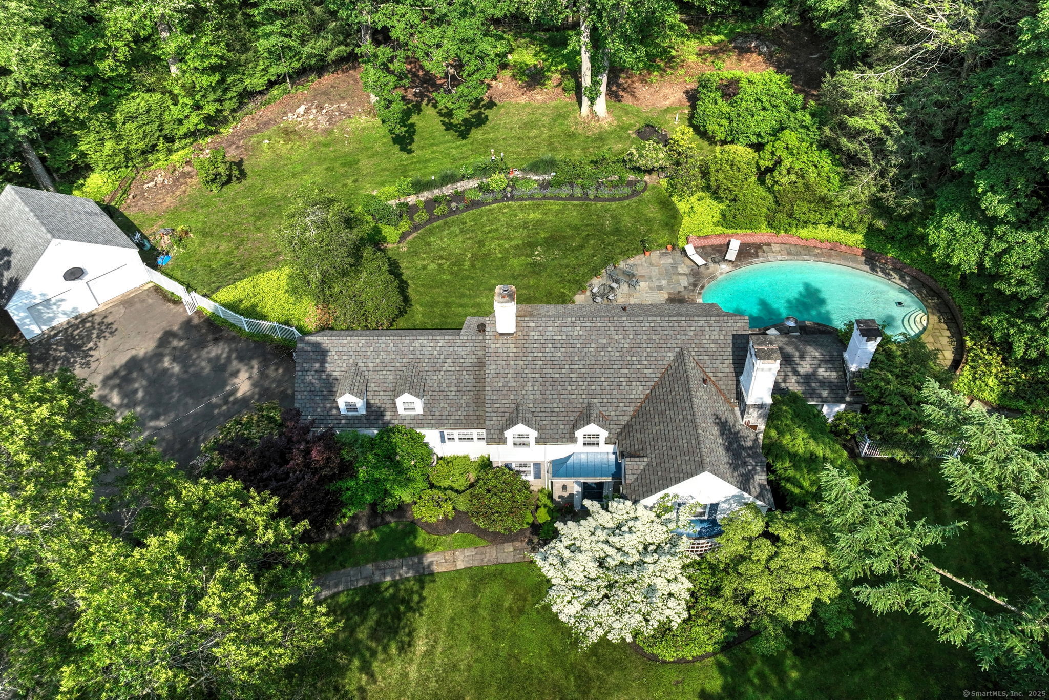4 Brook Road Woodbridge, CT 06525 - Photo 5 of 40 an aerial view of a house with a yard and outdoor seating