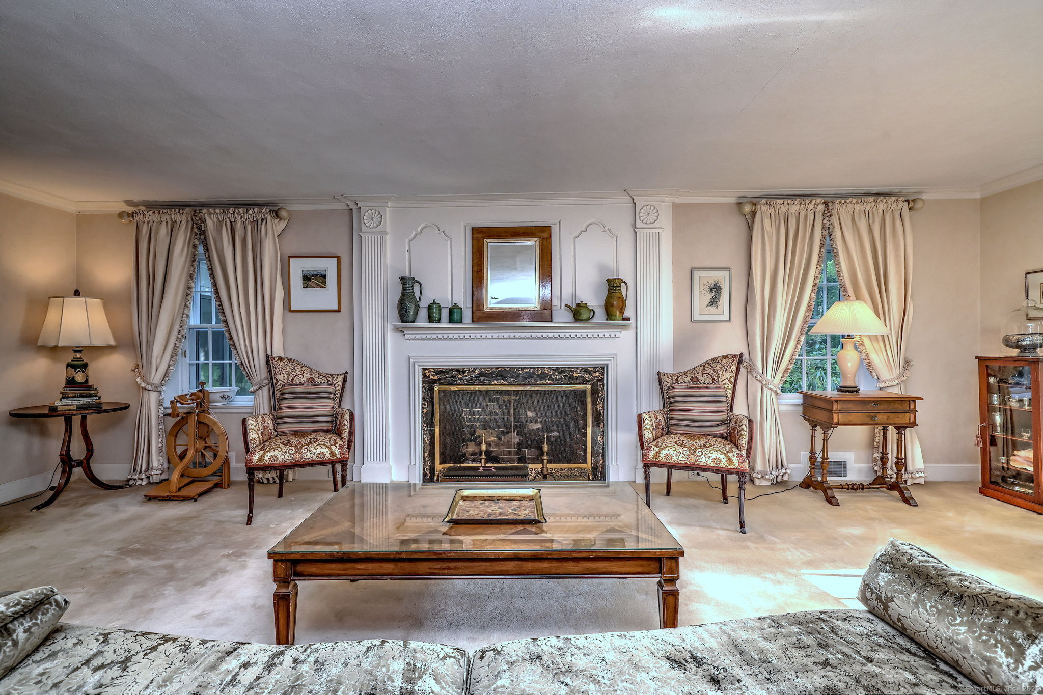 4 Brook Road Woodbridge, CT 06525 - Photo 10 of 40 a living room with furniture and a fireplace