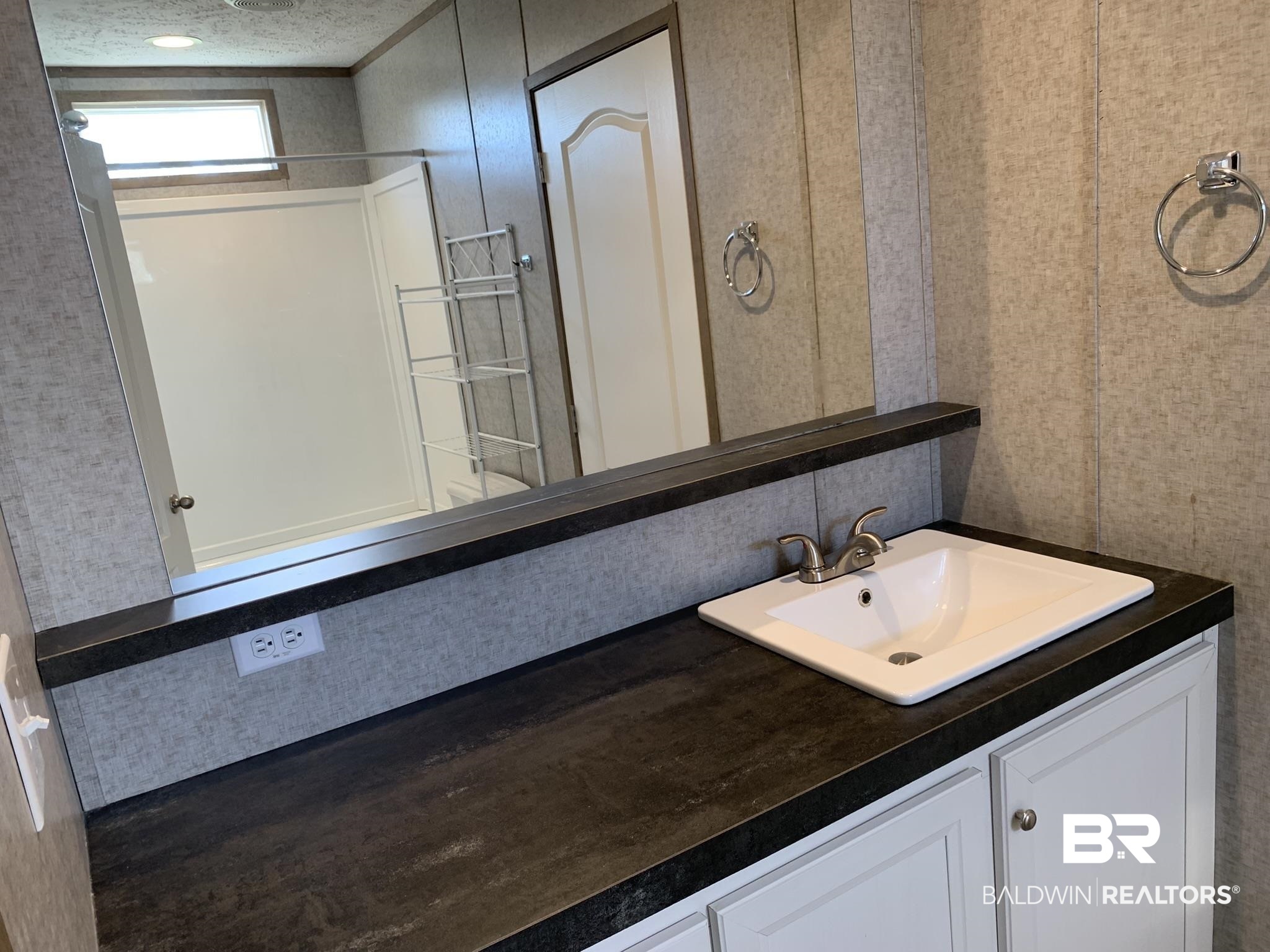 16876 County Road 87 Elberta, AL 36530 - Photo 13 of 13 Bathroom with hardwood / wood-style floors, a textured ceiling, and vanity