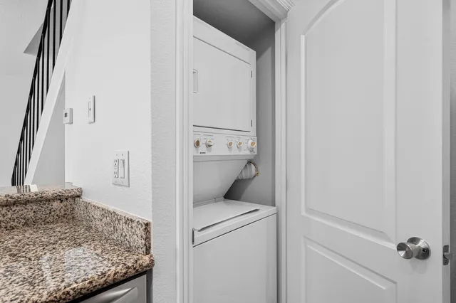 a view of a hallway with wooden floor and entryway