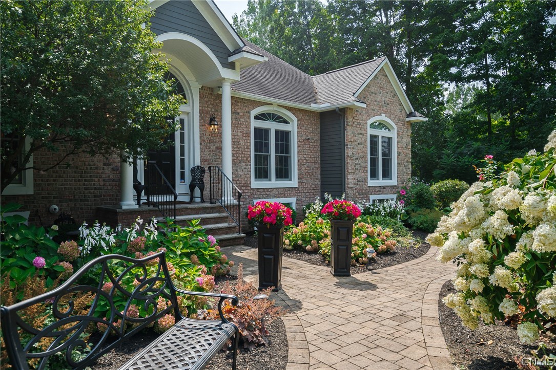8262 Ashington Drive Lysander, NY 13027 - Photo 2 of 50 HAVING SUCH A BEAUTIFUL WALKWAY ADDS TO THE OVERAL