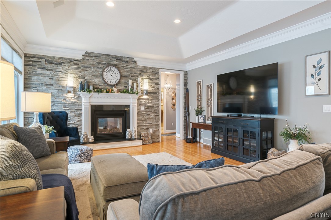 8262 Ashington Drive Lysander, NY 13027 - Photo 21 of 50 A FOCAL POINT OF THE ROOM IS THE ELEGANT FIREPLACE