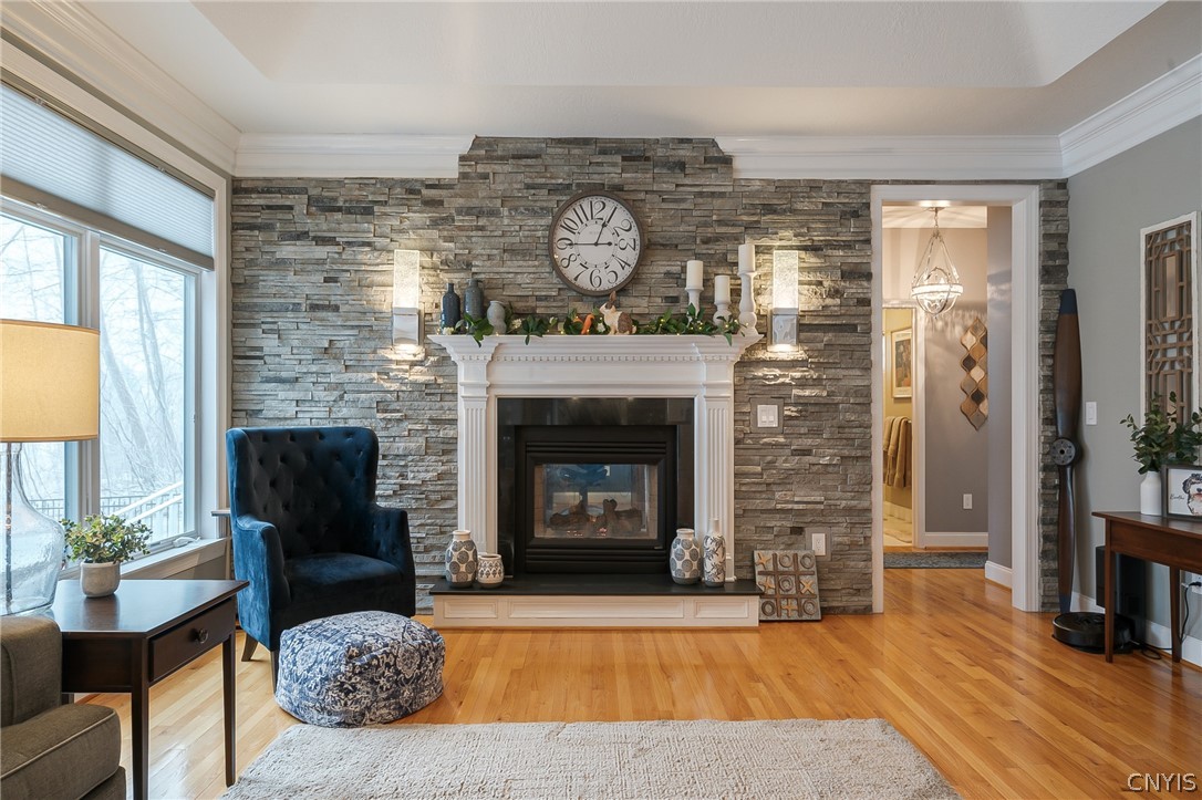 8262 Ashington Drive Lysander, NY 13027 - Photo 29 of 50 FLANKING THE FIREPLACE ARE ATTRACTIVE WALL SCONCES