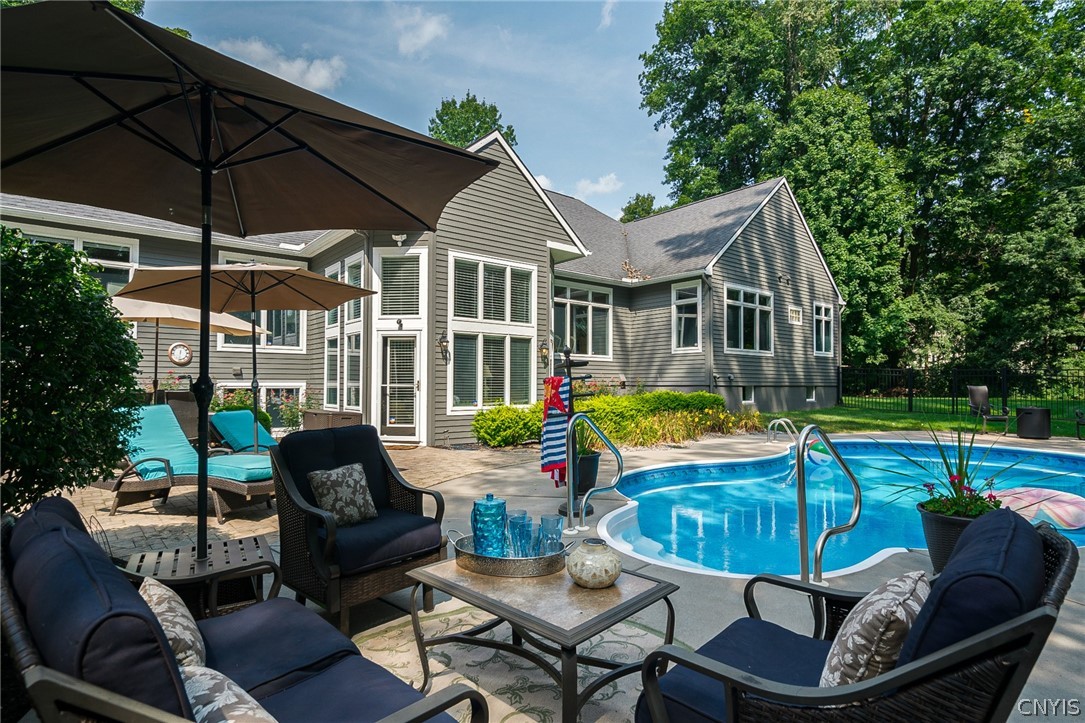 8262 Ashington Drive Lysander, NY 13027 - Photo 3 of 50 STEPPING OUT OF THE ATRIUM OFF THE BACK OF THE HOU