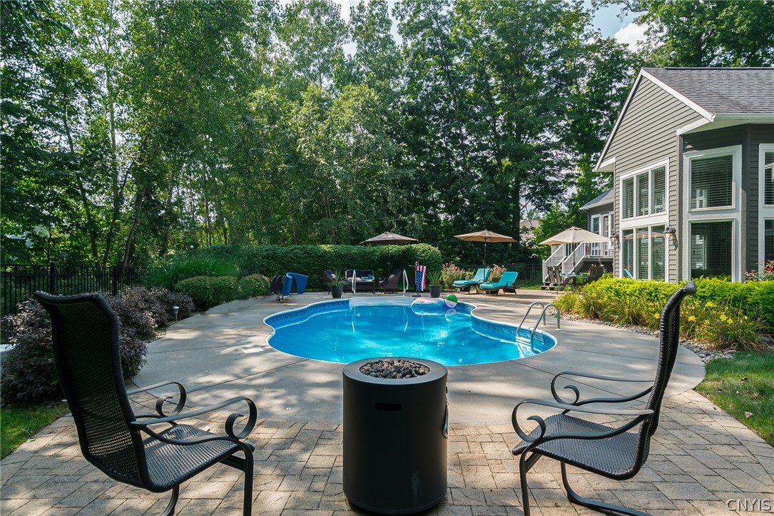 8262 Ashington Drive Lysander, NY 13027 - Photo 4 of 50 HAVING SEPERATE PATIO PAVER AREAS IN THE BACKYARD