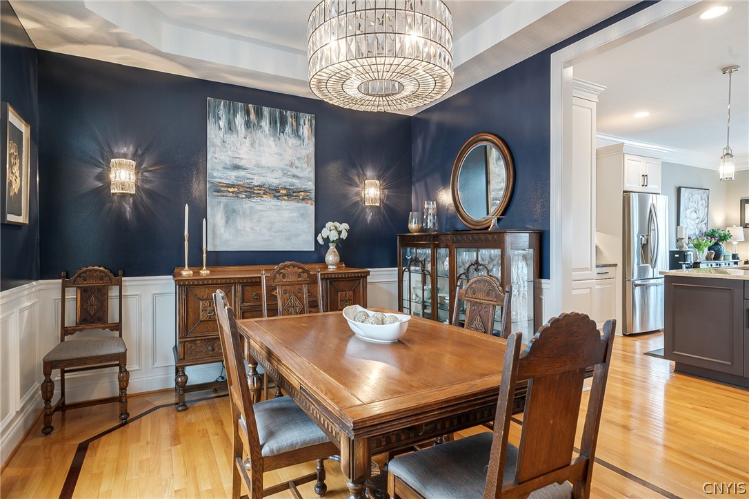 8262 Ashington Drive Lysander, NY 13027 - Photo 7 of 50 STEP INTO A LUXURIOUS FORMAL DINING ROOM THAT BLEN