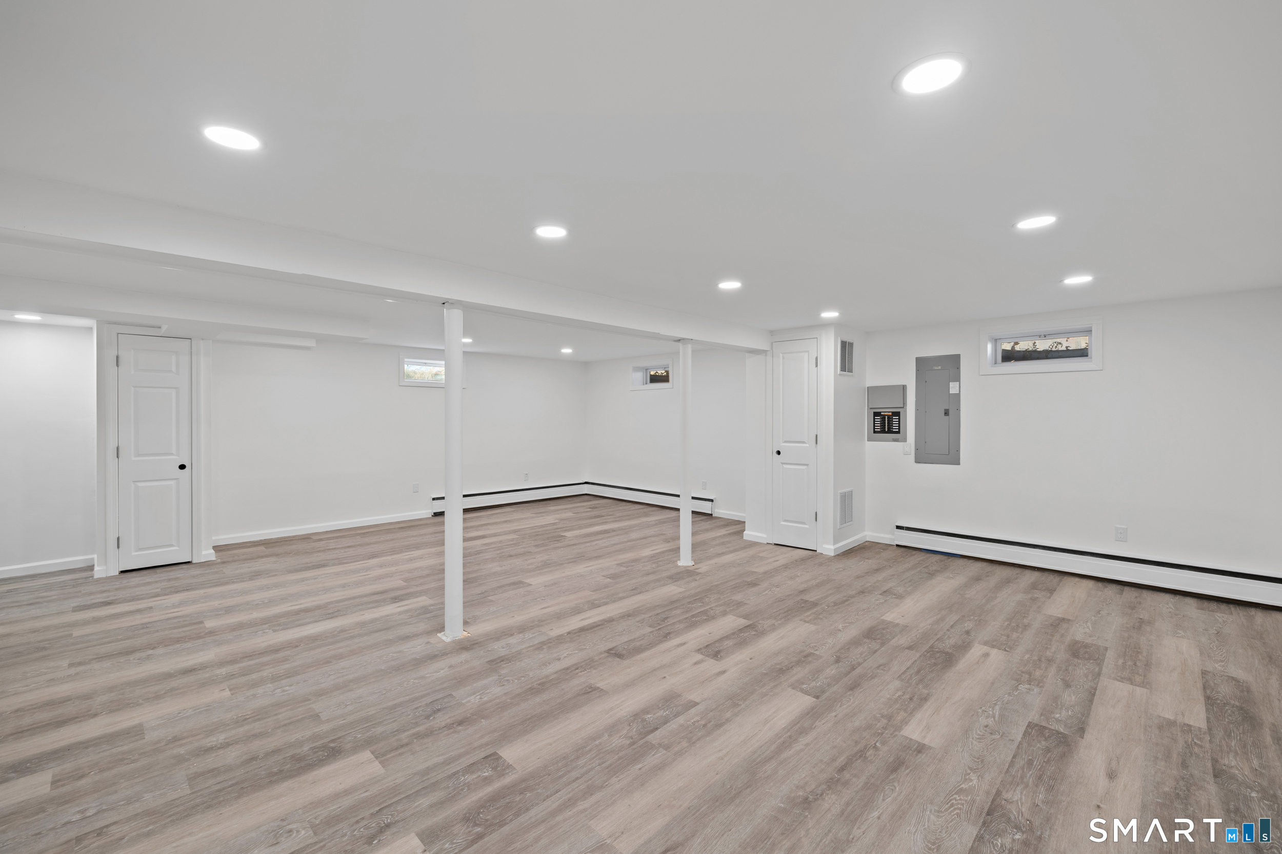 115 Wheeler Road Monroe, CT 06468 - Photo 14 of 18 a view of an empty room with wooden floor