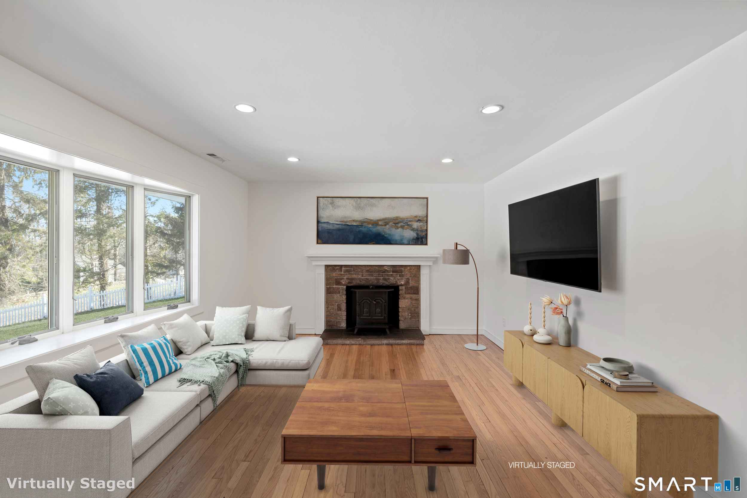 115 Wheeler Road Monroe, CT 06468 - Photo 5 of 18 a living room with furniture and a flat screen tv