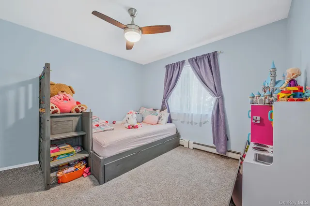 a bedroom with bed and window