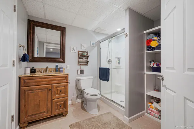 a spacious bathroom with a toilet sink and shower