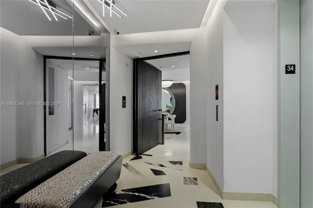 a bathroom with a glass shower door