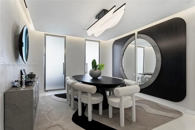 a living room with furniture potted plant and a flat screen tv