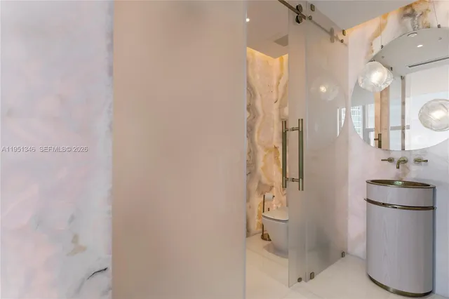 a bathroom with a tub and sink