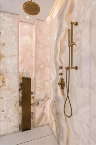 a bathroom with a bathtub and a shower