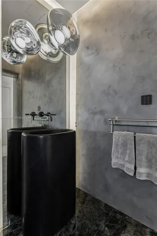 a kitchen with a table chairs sink and microwave