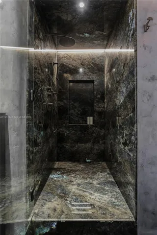 a kitchen with a sink a stove a refrigerator and cabinets