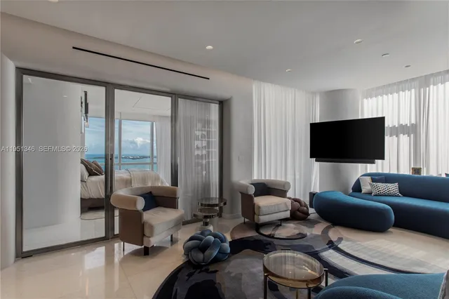 a living room with furniture and a table