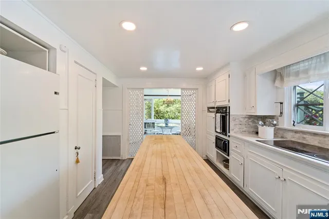 a spacious bedroom with a bed and a fireplace