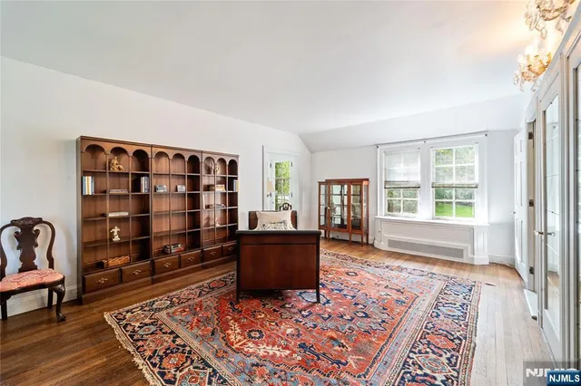 a view of a patio with table and chairs and wooden floor