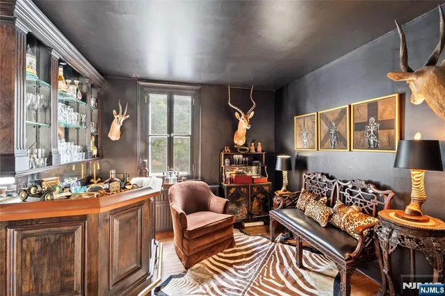 a living room with furniture fireplace and window