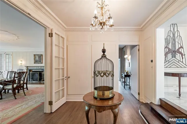 a living room with furniture a table and chairs