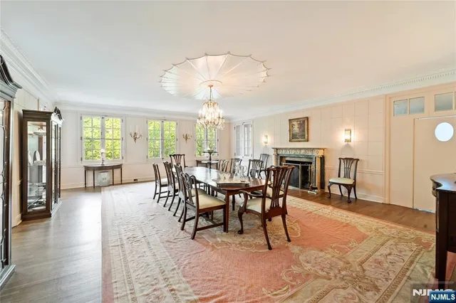 a view of entryway with wooden floor and windows