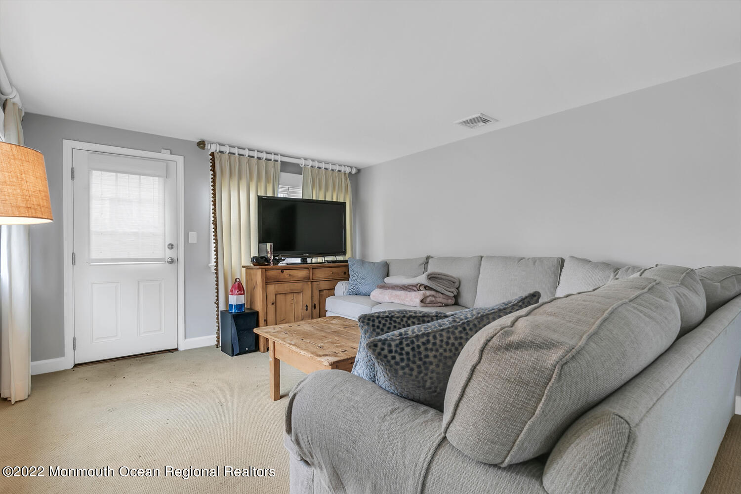 224 Garden Road Shrewsbury, NJ 07702 - Photo 11 of 33 a living room with a flat screen tv and a window
