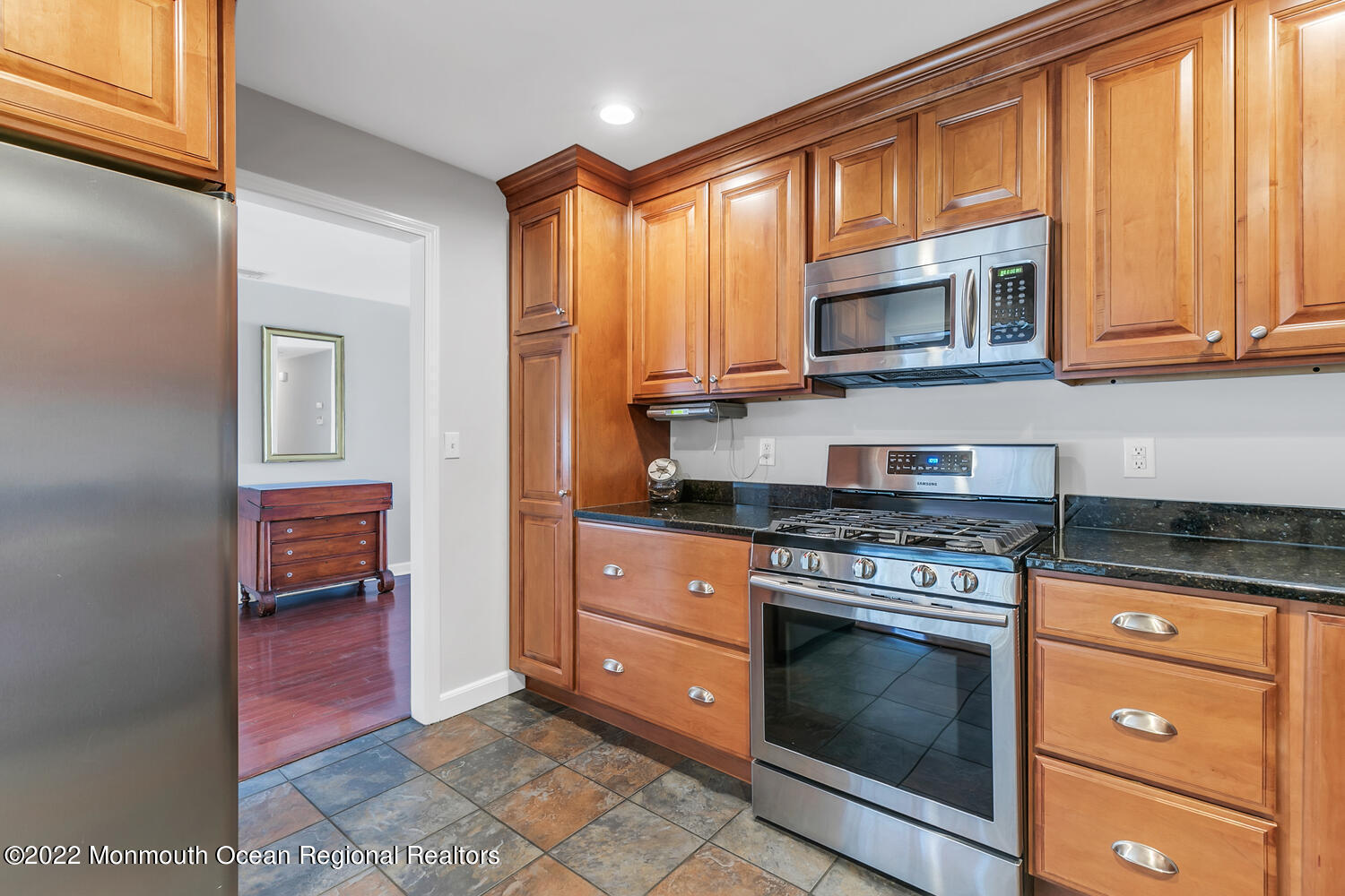 224 Garden Road Shrewsbury, NJ 07702 - Photo 15 of 33 a kitchen with stainless steel appliances granite countertop a stove and cabinets