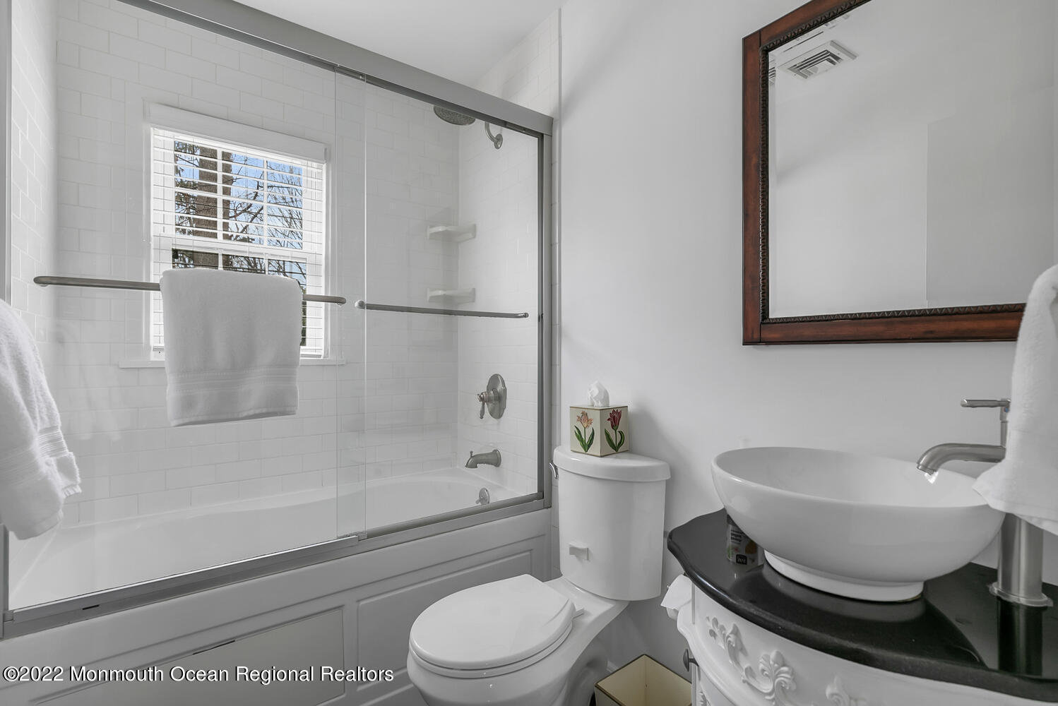 224 Garden Road Shrewsbury, NJ 07702 - Photo 19 of 33 a bathroom with a toilet a sink and a bathtub