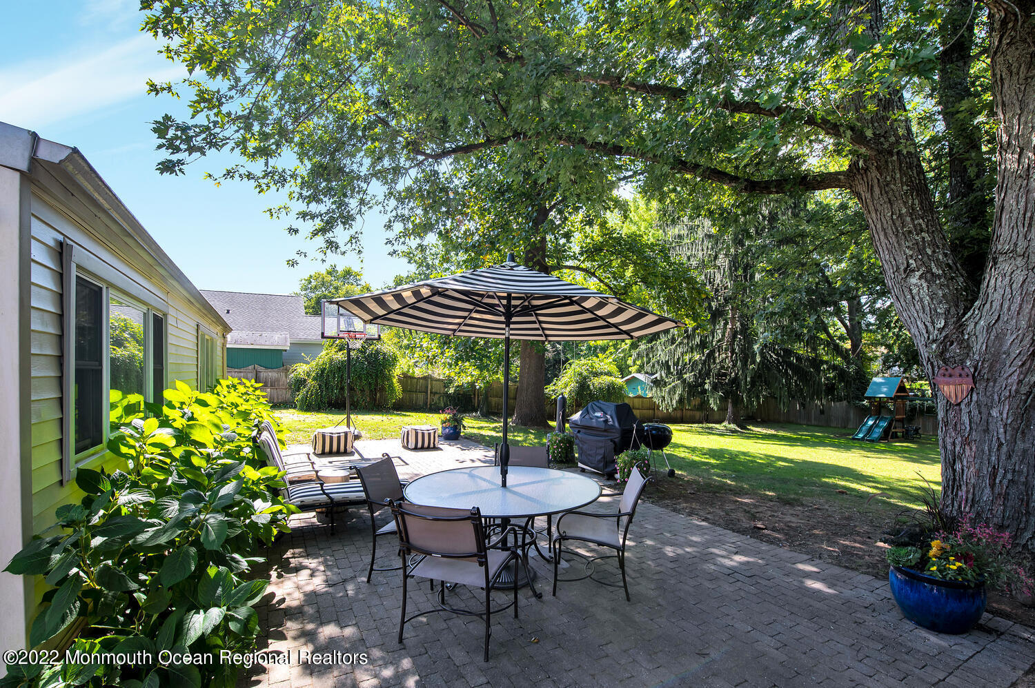 224 Garden Road Shrewsbury, NJ 07702 - Photo 25 of 33 a view of a table and chairs in backyard of the house
