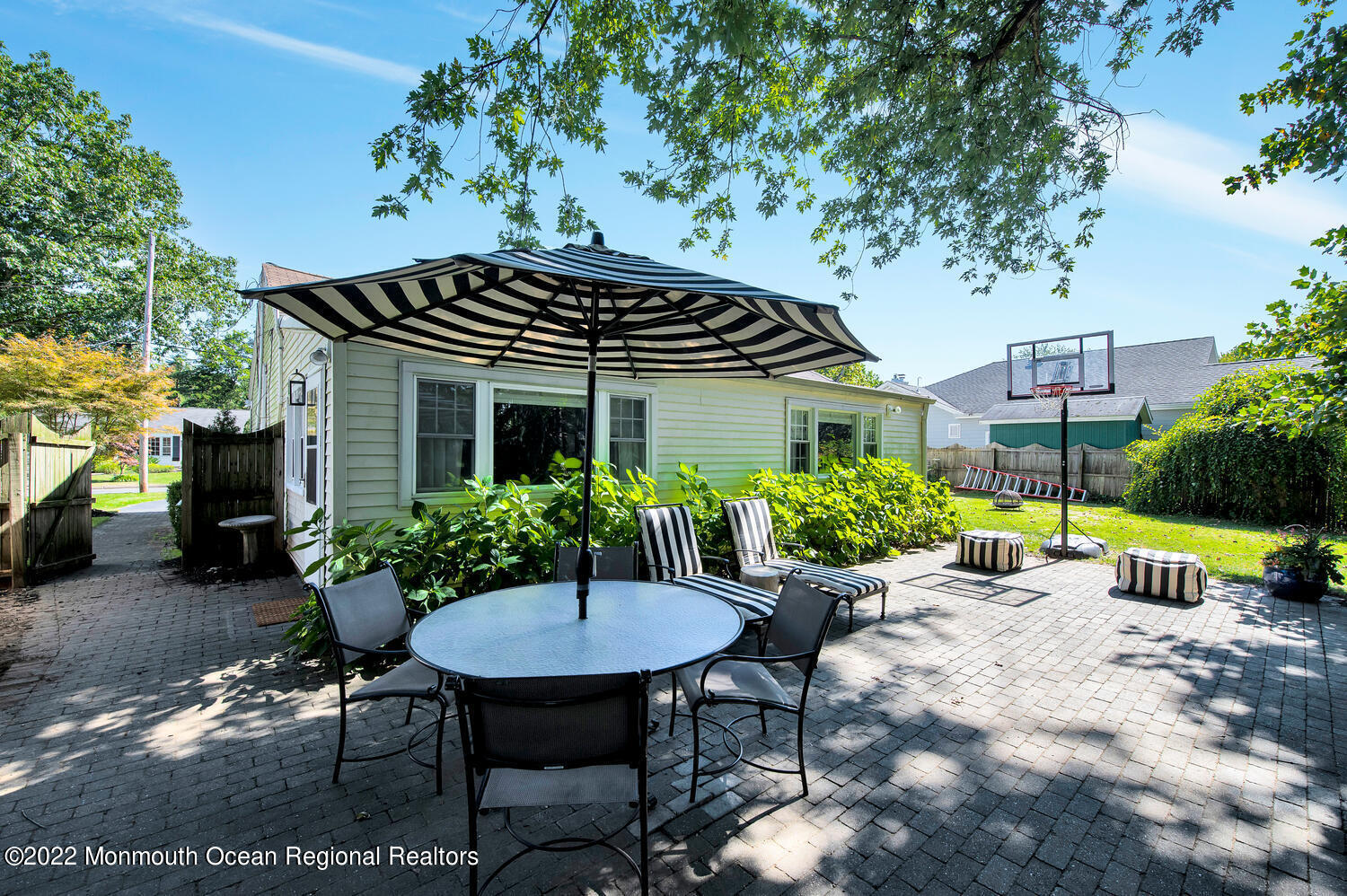 224 Garden Road Shrewsbury, NJ 07702 - Photo 31 of 33 a backyard of a house with table and chairs