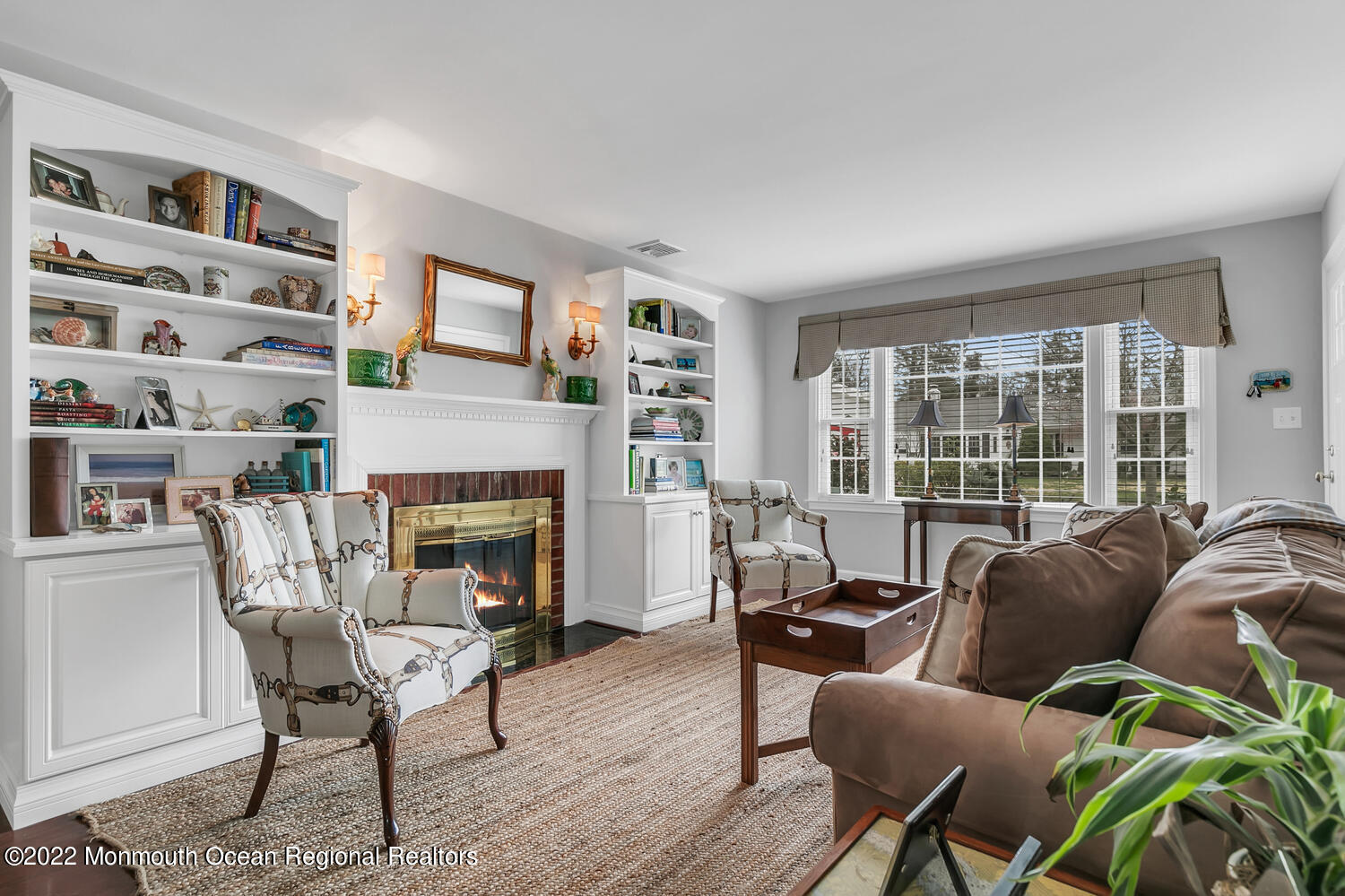 224 Garden Road Shrewsbury, NJ 07702 - Photo 7 of 33 a living room with furniture a fireplace and a large window