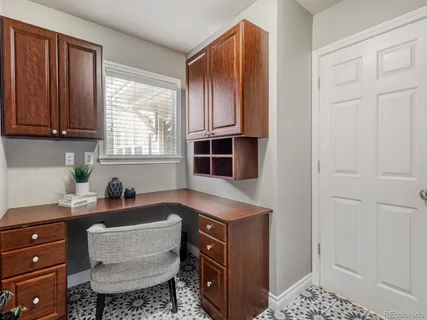 a kitchen with a cabinets and window