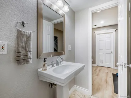 a bathroom with a sink and a mirror
